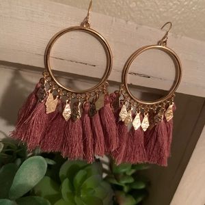 Golden hoop earrings with light plum tassels